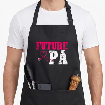 Appreciation student aprons - FUTURE PA text with pink heart stethoscope and distressed white letters — shown on a black cotton canvas apron against a white background