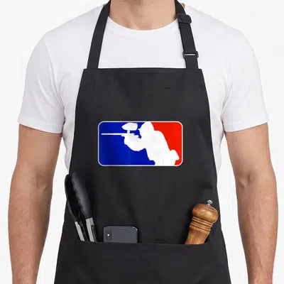 Paintball major apron - White paintball player silhouette inside a blue and red rectangular block — shown on a black cotton canvas apron against a white background