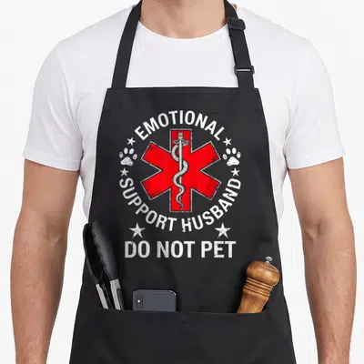 Cute emotional husband apron - Red Star of Life with snake sword and text Emotional Support Husband Do Not Pet — shown on a black cotton canvas apron against a white background