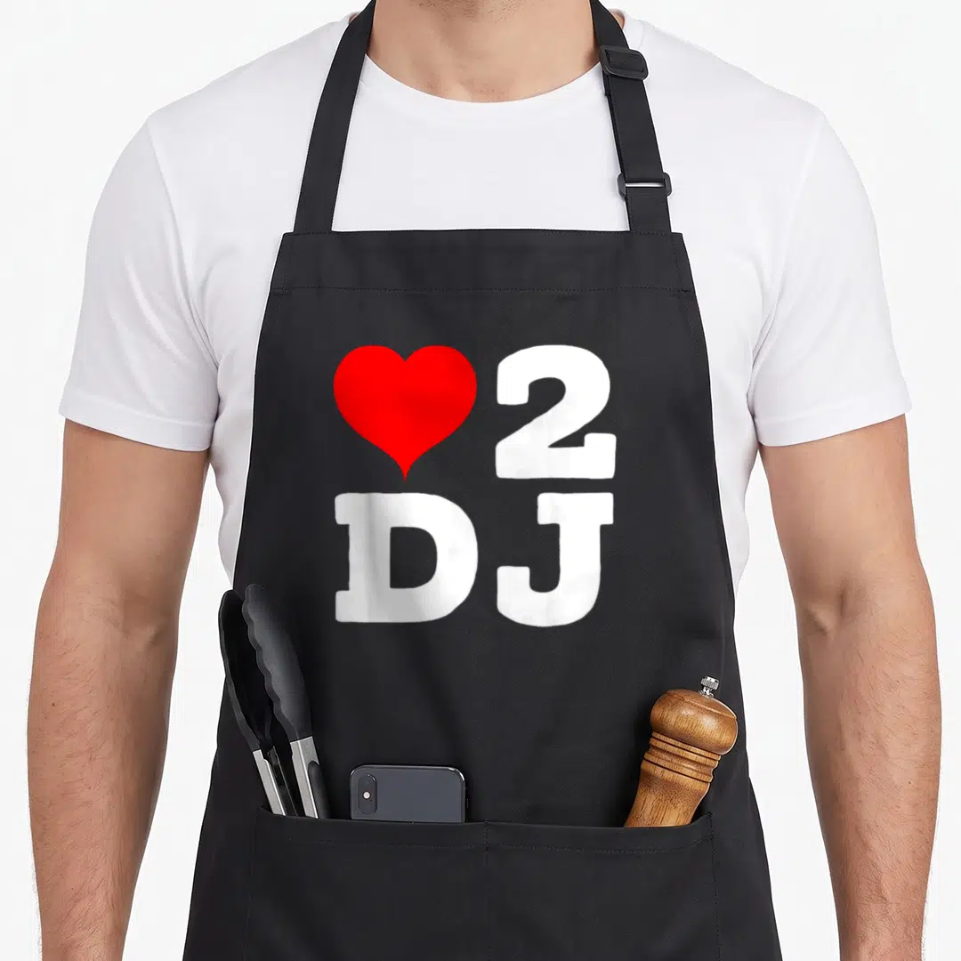 Concert j apron - Red heart next to white 2 and DJ letters — shown on a black cotton canvas apron against a white background