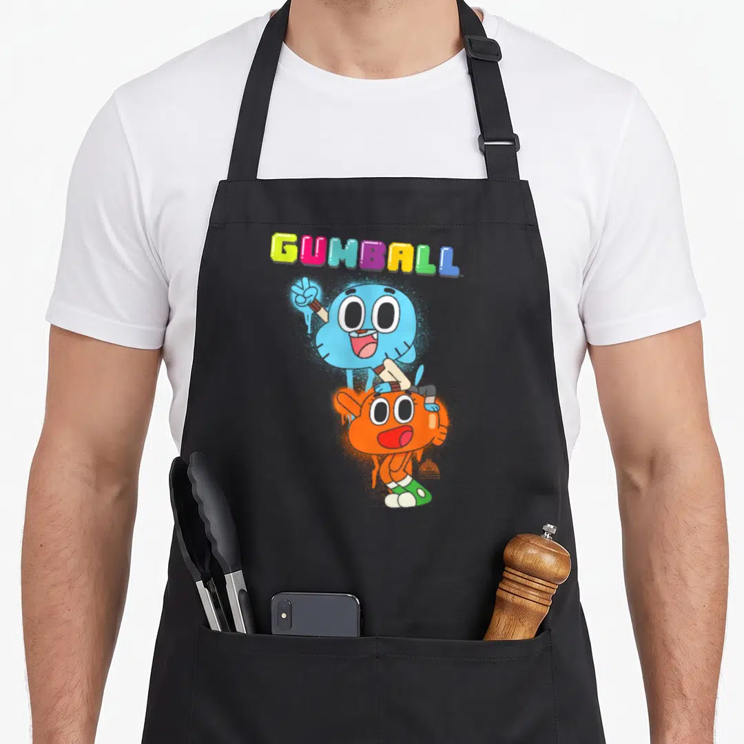 Amazing black cat apron - Multi-colored GUMBALL text above a blue cat standing behind an orange fish in a cartoon style — shown on a black cotton canvas apron against a white background