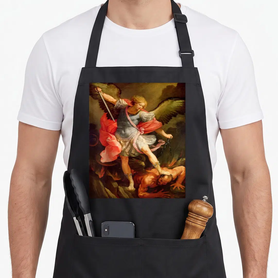 Archangel angels in aprons - Archangel Michael in red blue brown gold robes holding sword and chains over defeated demon — shown on a black cotton canvas apron against a white background