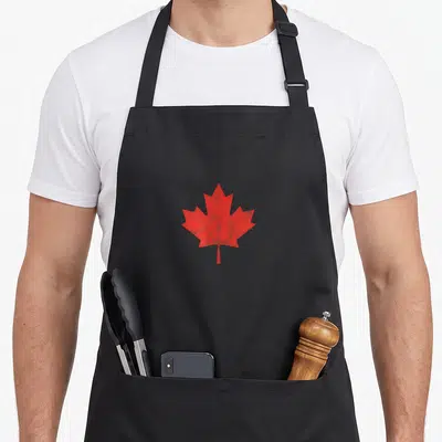 Flag canada canadian aprons - Red maple leaf silhouette centered on grey background, no text — shown on a black cotton canvas apron against a white background