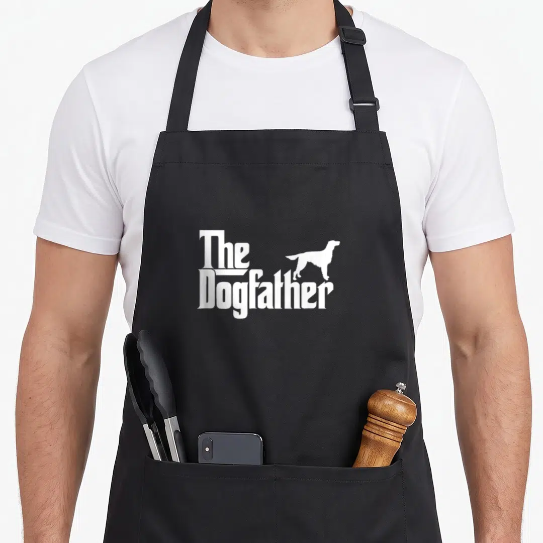 Dogfather irish dog apron - White stacked text The Dogfather with standing dog silhouette — shown on a black cotton canvas apron against a white background