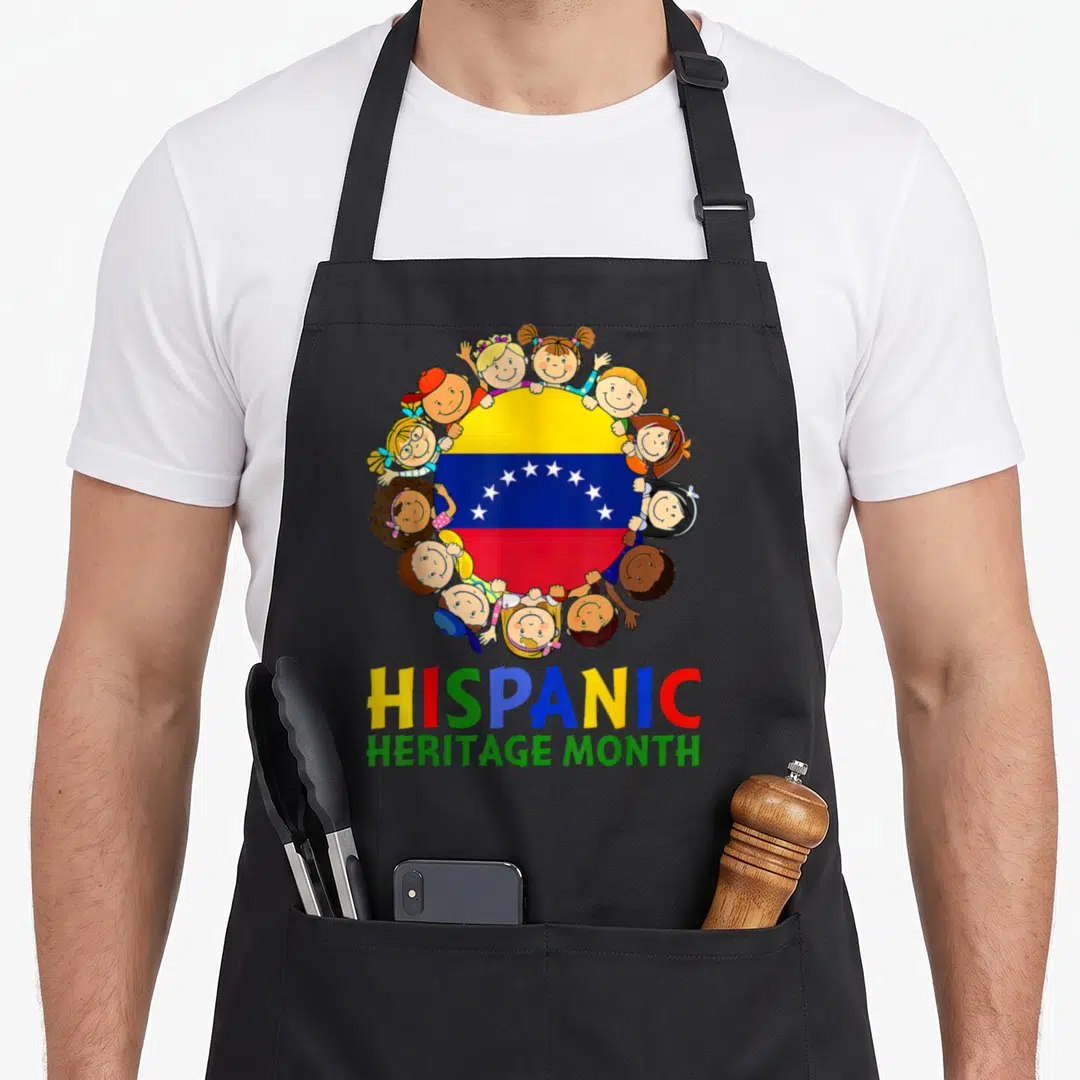 Venezuela hispanic aprons - Cartoon children surround circular Venezuelan flag with multicolored HISPANIC HERITAGE — shown on a black cotton canvas apron against a white background