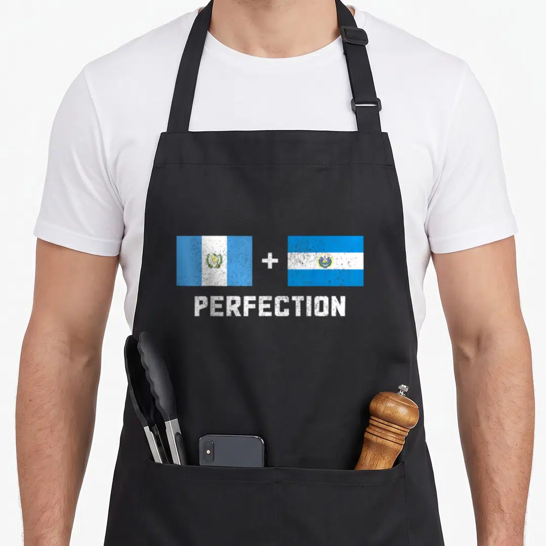 Salvadorian guatemalan aprons - Two blue and white flags with plus sign above PERFECTION text — shown on a black cotton canvas apron against a white background