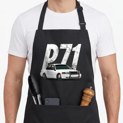 Crown car apron - White police car with push bar in front of P71 text — shown on a black cotton canvas apron against a white background