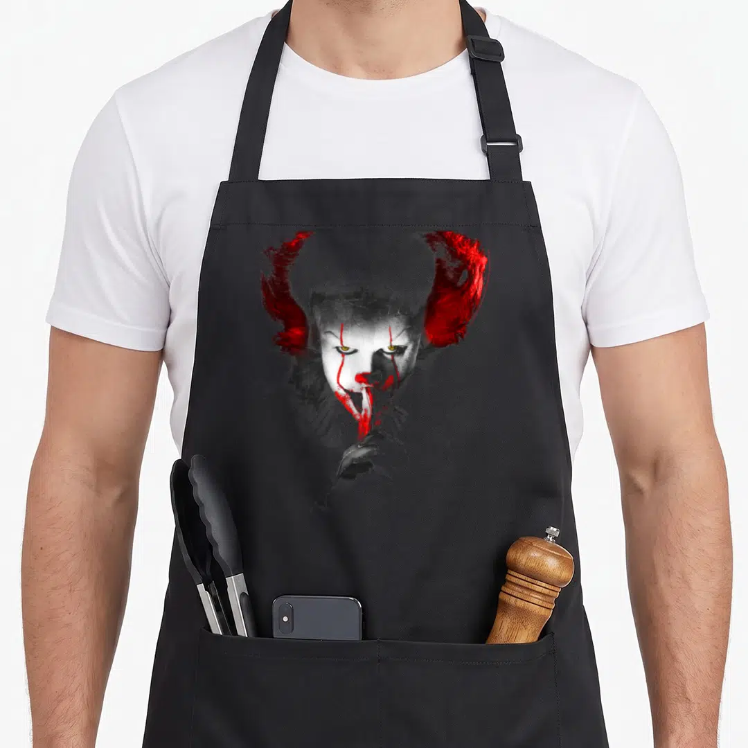 Clown bloody apron - Realistic Pennywise portrait shushing gesture in white red and grey — shown on a black cotton canvas apron against a white background