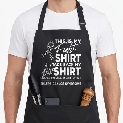 Fight eds awareness apron - Zebra awareness ribbon and distressed text reading This Is My Fight Shirt Ehlers-Danlos — shown on a black cotton canvas apron against a white background