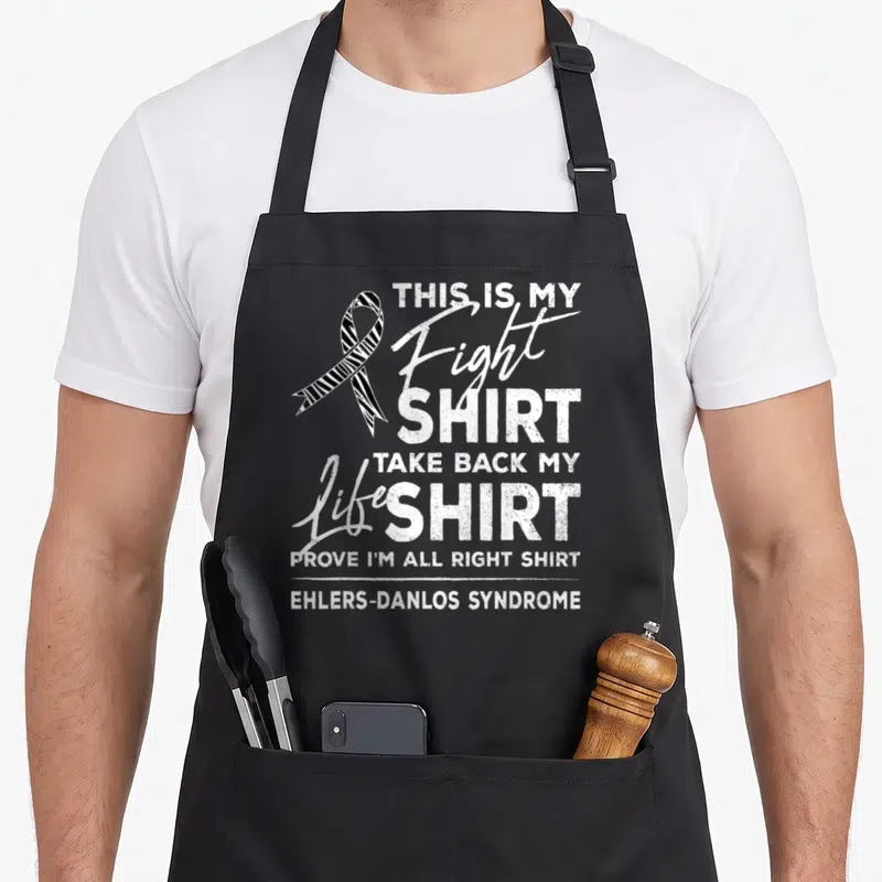 Fight eds awareness apron - Zebra awareness ribbon and distressed text reading This Is My Fight Shirt Ehlers-Danlos — shown on a black cotton canvas apron against a white background