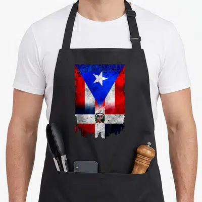 Dominirican preacher apron - DOMINICAN text over distressed Dominican Puerto Rico flag merge with coat of arms and star — shown on a black cotton canvas apron against a white background