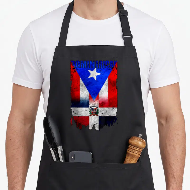 Dominirican preacher apron - DOMINICAN text over distressed Dominican Puerto Rico flag merge with coat of arms and star — shown on a black cotton canvas apron against a white background