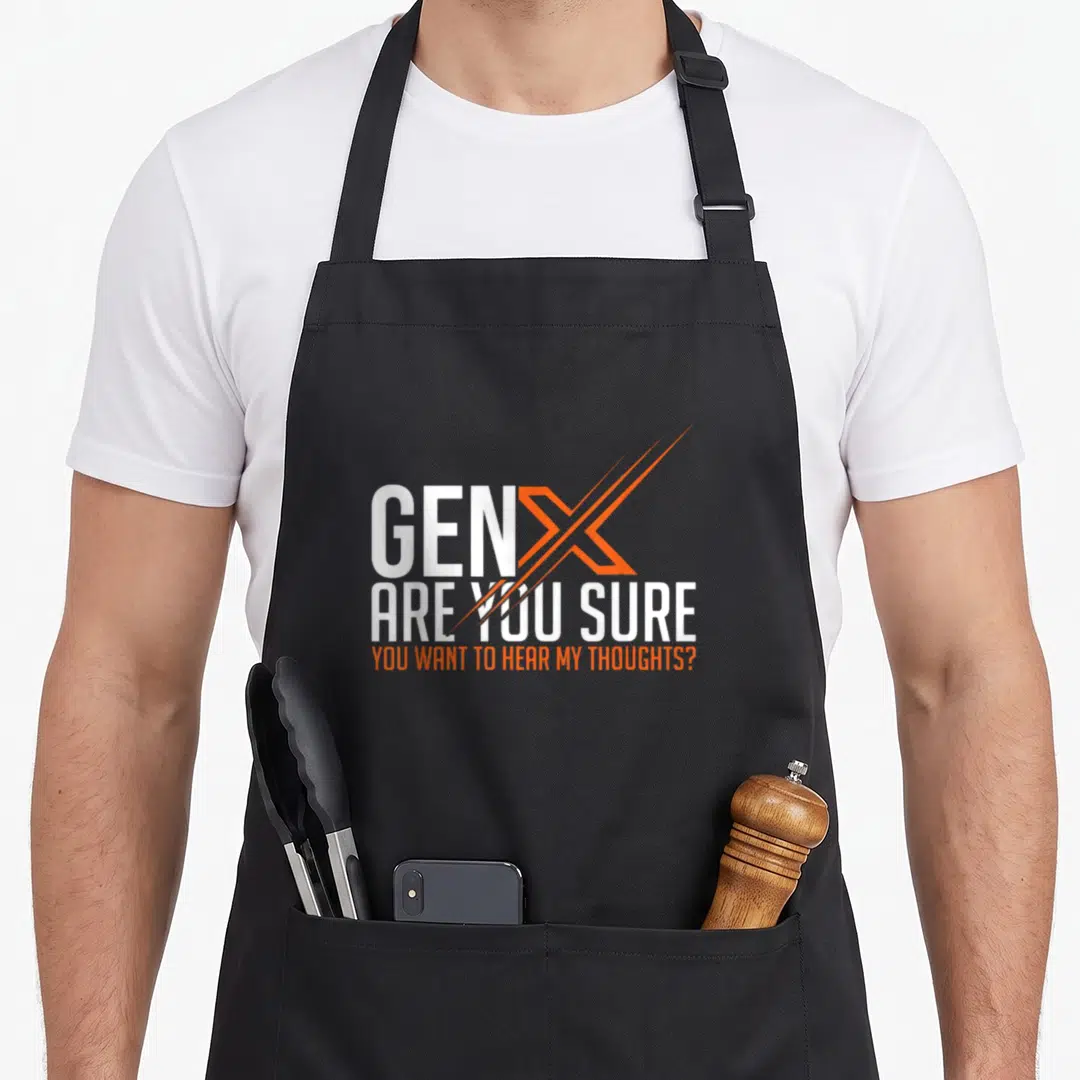 Generation 60s apron - White and orange stacked text reading Gen X Are You Sure You Want To Hear My Thoughts — shown on a black cotton canvas apron against a white background