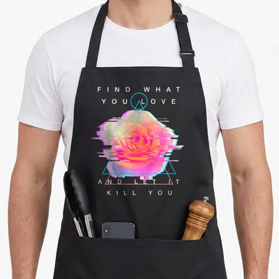 Find rose apron - Glitched rose in cyan triangle with white text FIND WHAT YOU LOVE AND LET IT KILL YOU — shown on a black cotton canvas apron against a white background
