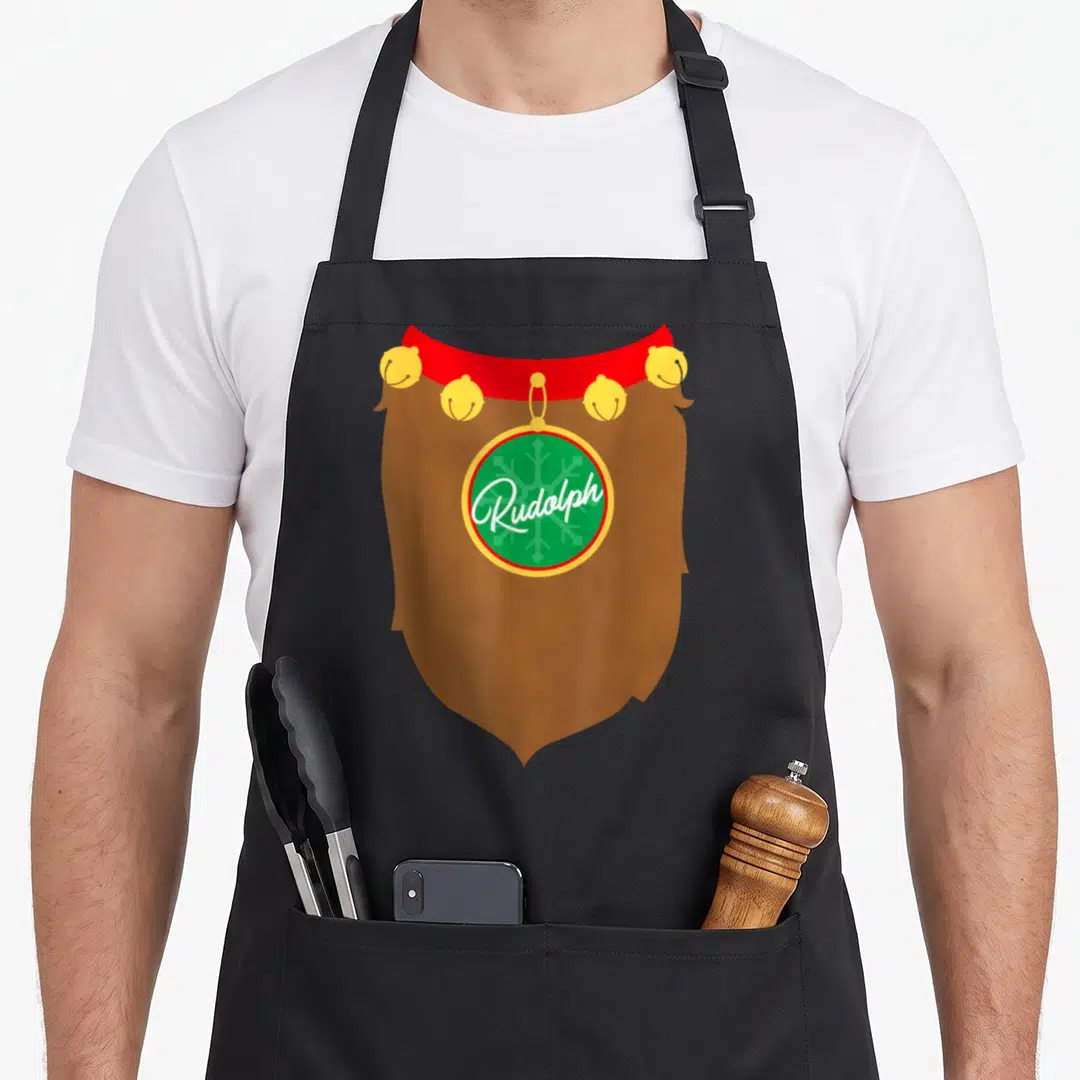 Rudolph reindeer christmas apron - Brown beard graphic with four gold bells and green ornament reading Rudolph in white — shown on a black cotton canvas apron against a white background