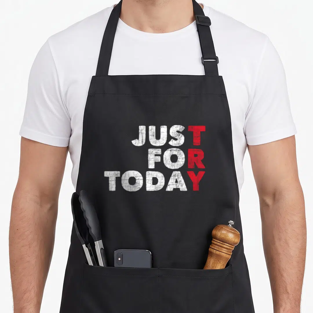 Today dont give apron - Stacked white and red Just For Today typography on black background — shown on a black cotton canvas apron against a white background