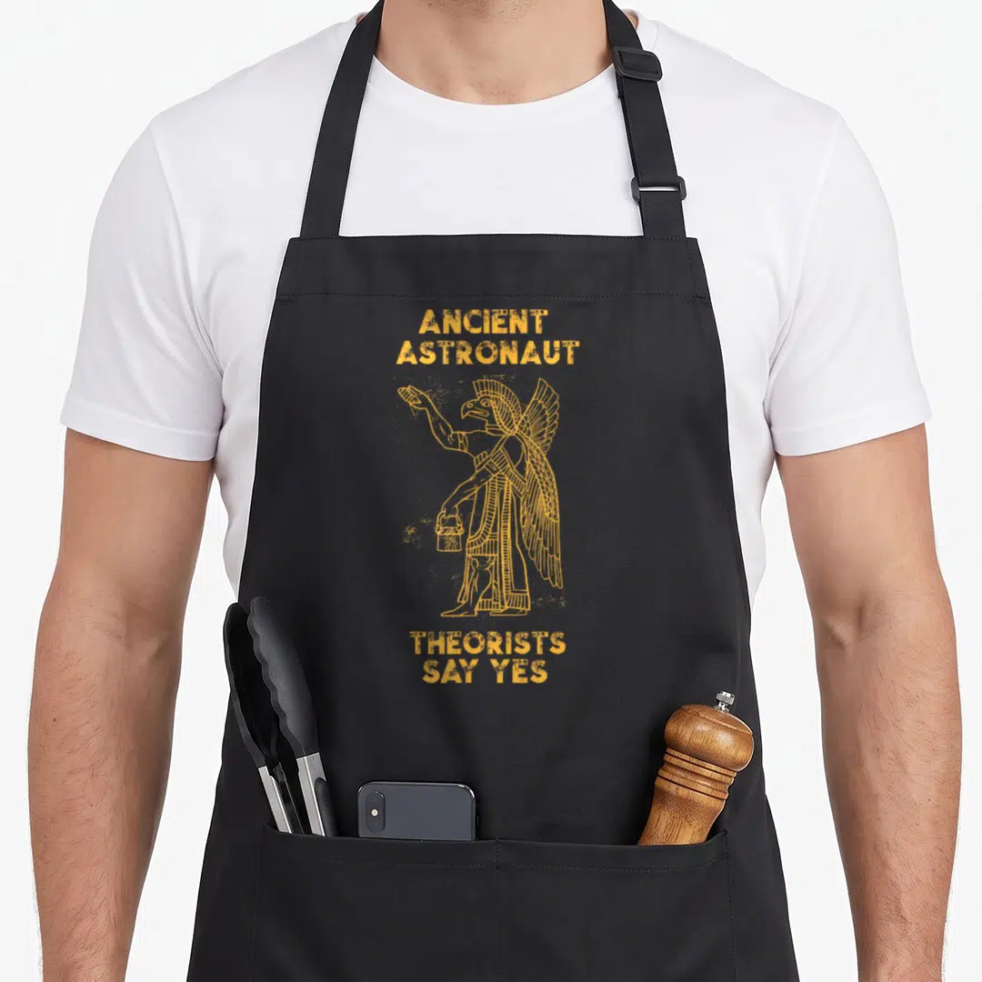 Anunnaki theorist apron - Orange distressed text Ancient Astronaut Theorists Say Yes around winged deity holding bucket — shown on a black cotton canvas apron against a white background
