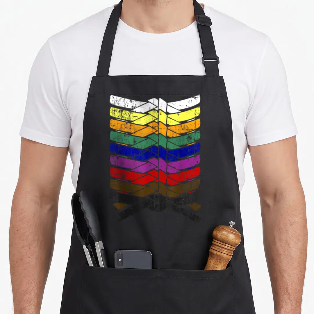 Illustrated martial arts instructor apron - Nine stacked martial arts belts in white, yellow, orange, green, blue — shown on a black cotton canvas apron against a white background