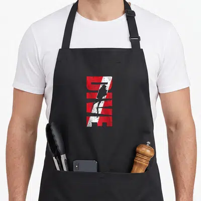 Diver zip apron - Red and white graphic Z with diver silhouette in diagonal stripe — shown on a black cotton canvas apron against a white background