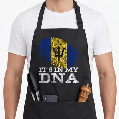 Dna barbadian apron - Distressed fingerprint in blue yellow and black with trident and stacked white text — shown on a black cotton canvas apron against a white background