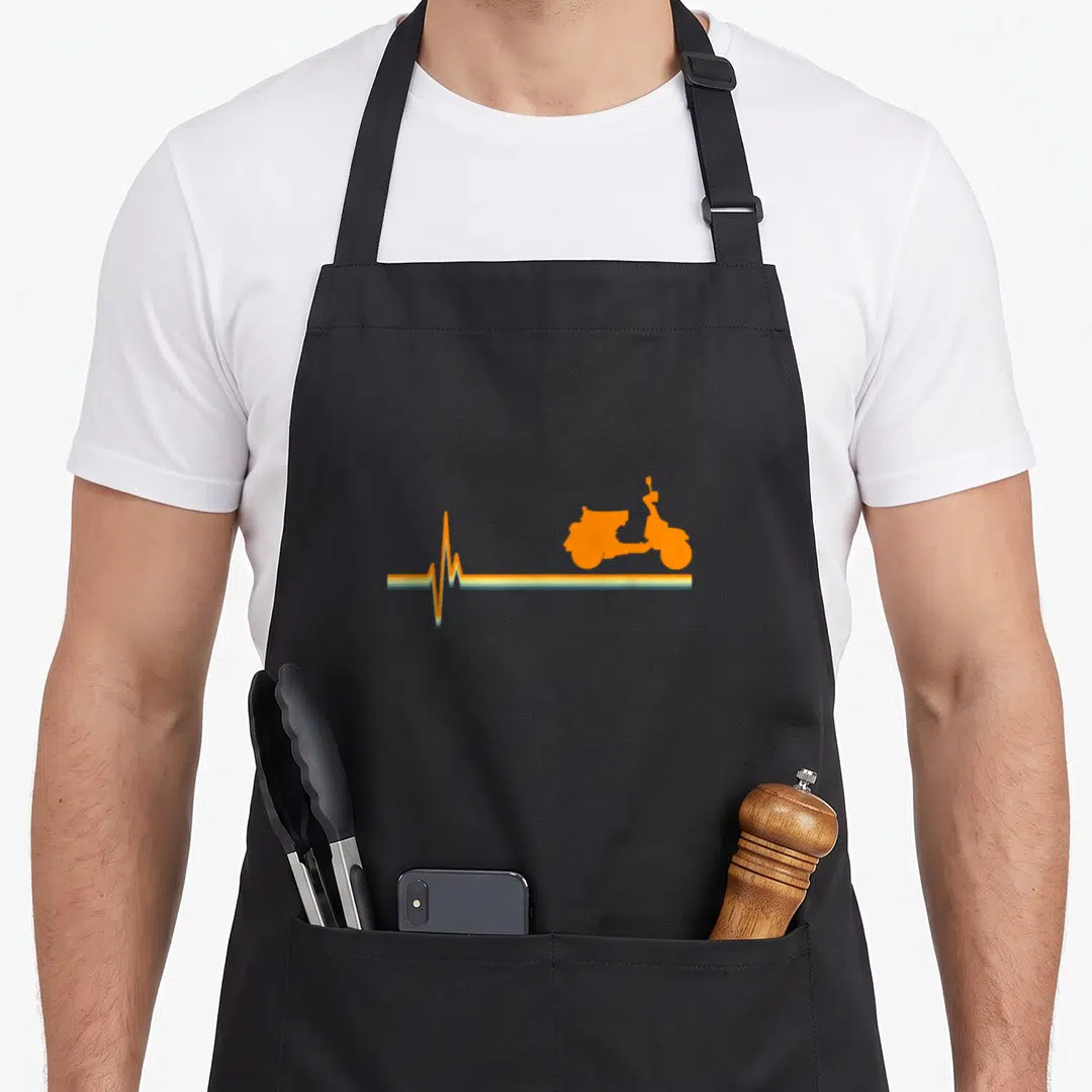 Heartbeat scooter apron - Orange scooter silhouette on horizontal heartbeat line with teal yellow orange stripes — shown on a black cotton canvas apron against a white background