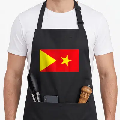 Tigray ethiopian boy apron - Red rectangular flag with yellow triangle and star centered on fabric — shown on a black cotton canvas apron against a white background