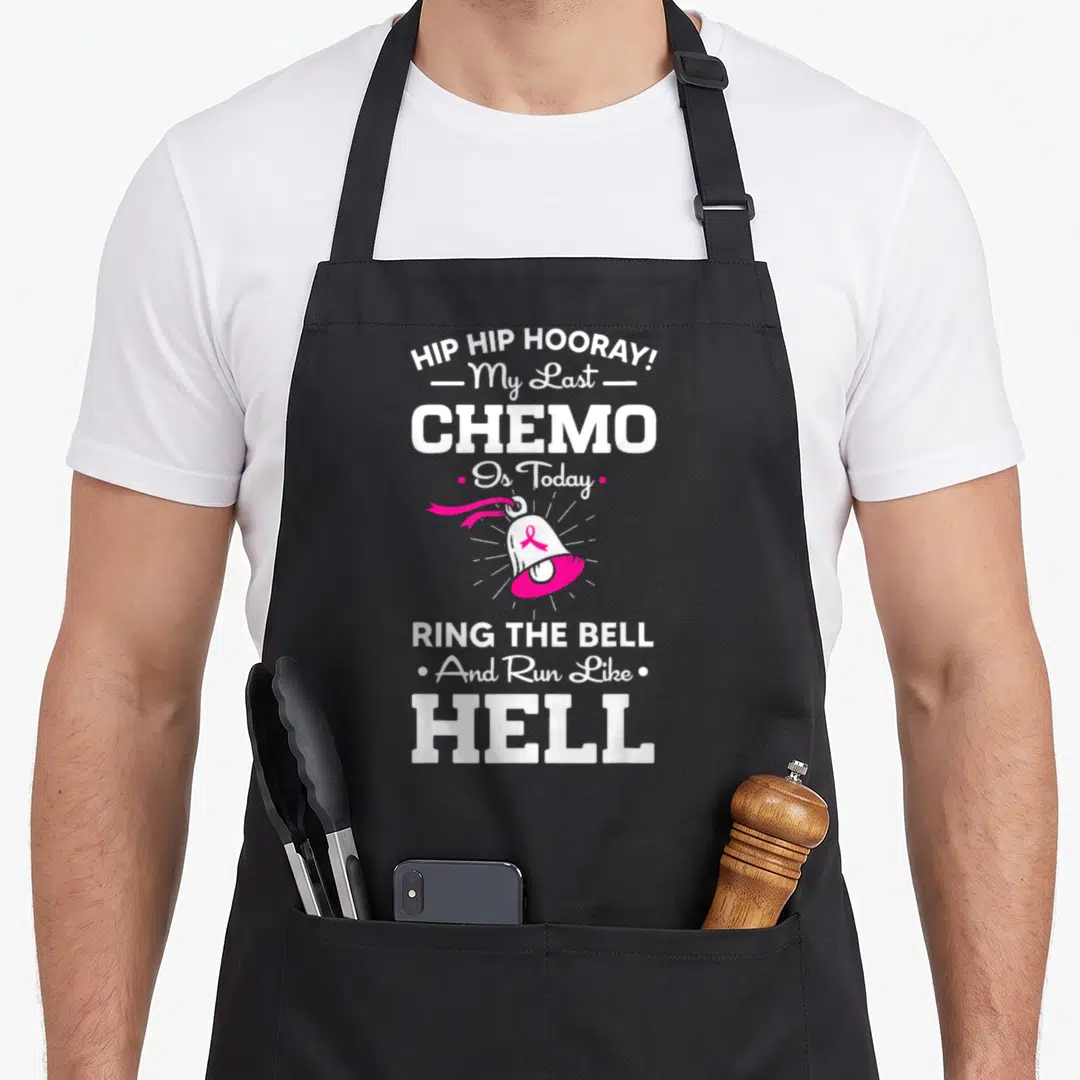 Today ring apron - White and pink typography reading Hip Hip Hooray My Last Chemo Is Today Ring The Bell And Run Like — shown on a black cotton canvas apron against a white background