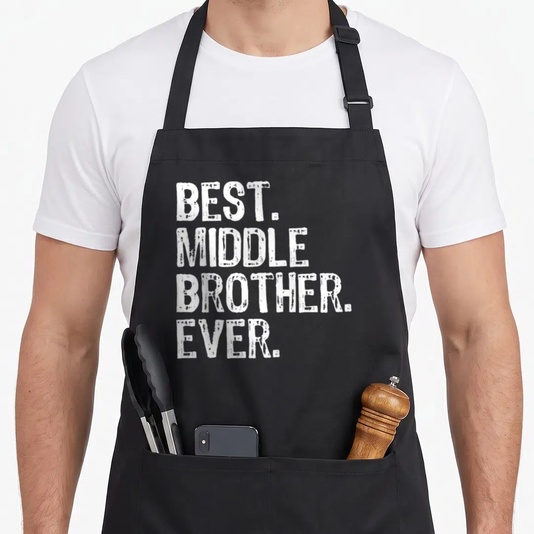 Middle crazy better apron - White stacked text reading BEST. MIDDLE BROTHER. EVER. on grey background — shown on a black cotton canvas apron against a white background