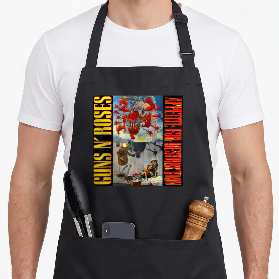 Appetite gun apron - Guns N Roses skeleton art with red cross and vertical yellow text banners on black background — shown on a black cotton canvas apron against a white background
