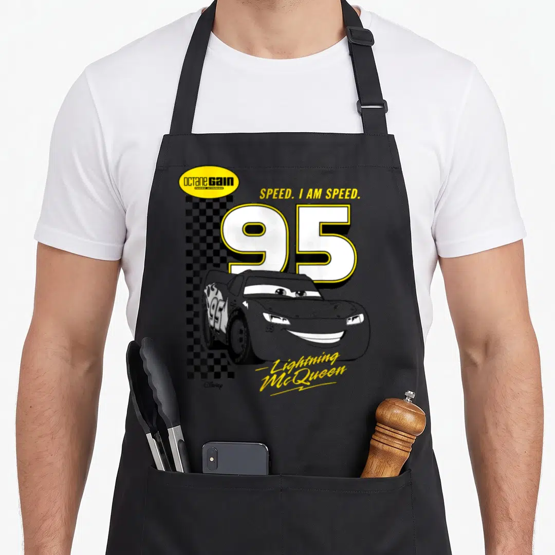 Speed car apron - Lightning McQueen 95 with octane GAIN logo and checkered flag pattern — shown on a black cotton canvas apron against a white background