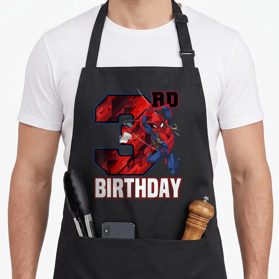 Swing birthday apron - Spider-Man leaping over red number 3 with RD and BIRTHDAY text in cartoon style — shown on a black cotton canvas apron against a white background