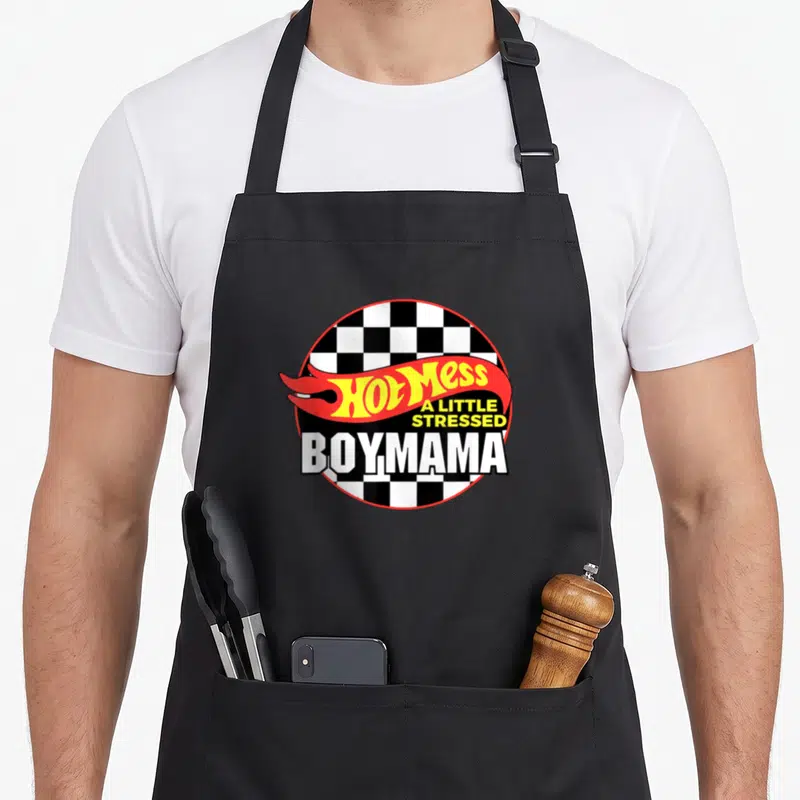 Mess mama apron - Hot Mess A Little Stressed BOYMAMA text on checkered circle with red flame — shown on a black cotton canvas apron against a white background
