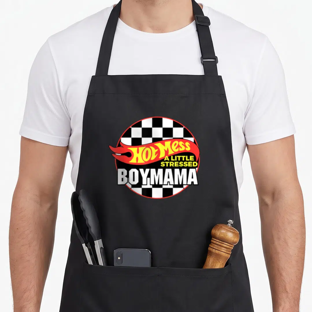 Mess mama apron - Hot Mess A Little Stressed BOYMAMA text on checkered circle with red flame — shown on a black cotton canvas apron against a white background