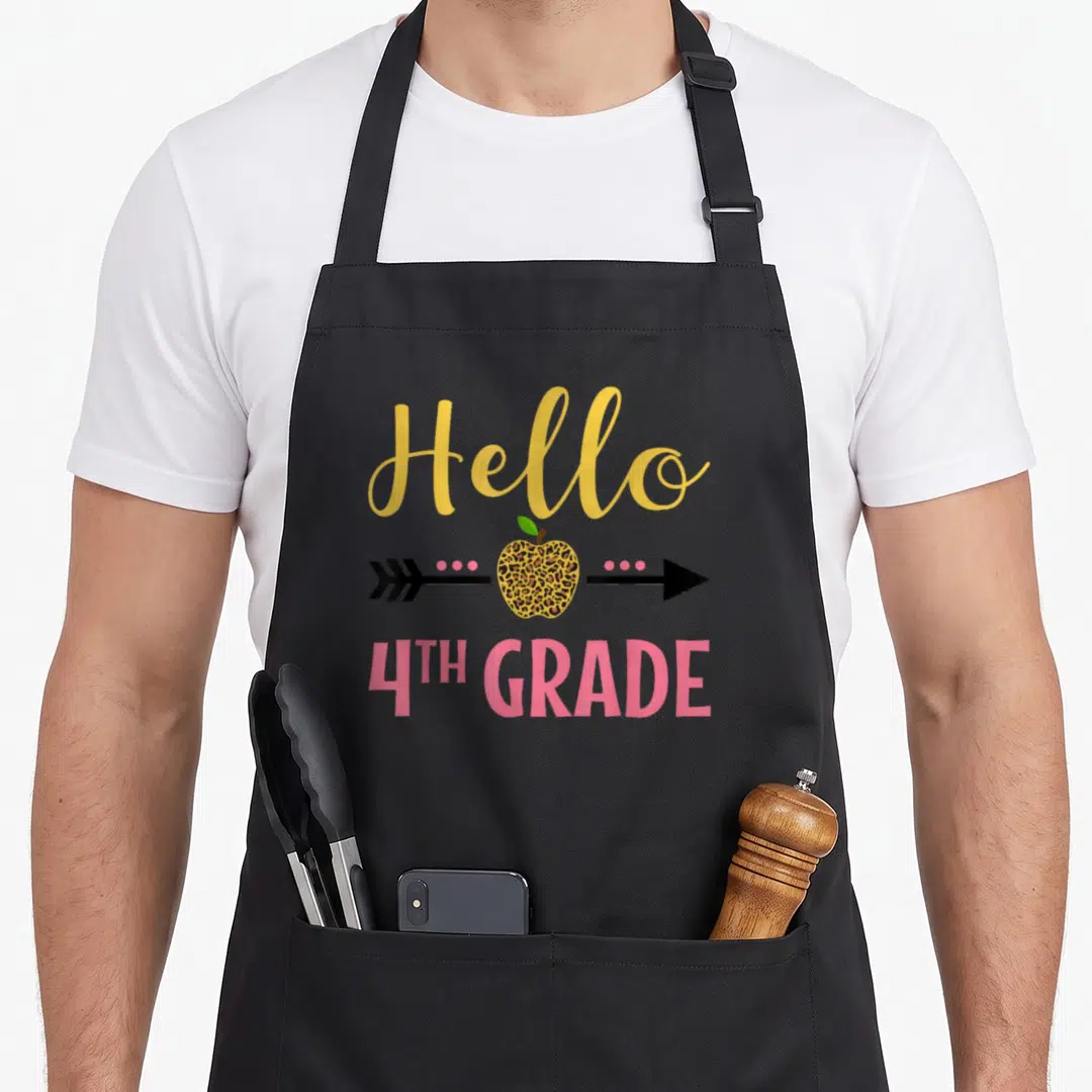 Hello leopard apron - Hello 4th Grade text with leopard print apple and arrow graphic — shown on a black cotton canvas apron against a white background