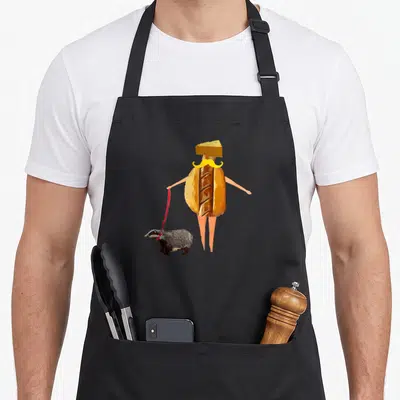 Brat badger apron - Cartoon hot dog person with cheese hat and yellow mustache holding red leash attached to badger — shown on a black cotton canvas apron against a white background