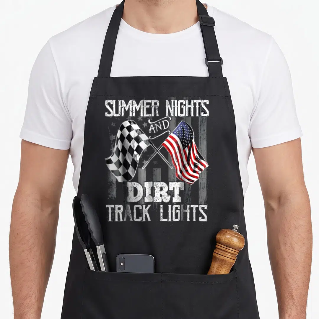 Summer track apron - Crossed checkered and American flags with distressed text SUMMER NIGHTS AND DIRT TRACK LIGHTS — shown on a black cotton canvas apron against a white background