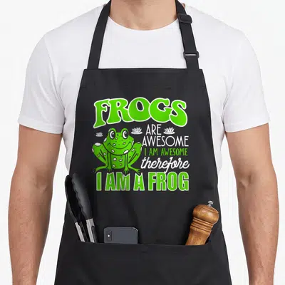 Funny toad frog aprons - Stacked text FROGS ARE AWESOME I AM AWESOME therefore I AM A FROG with small lotus icons — shown on a black cotton canvas apron against a white background
