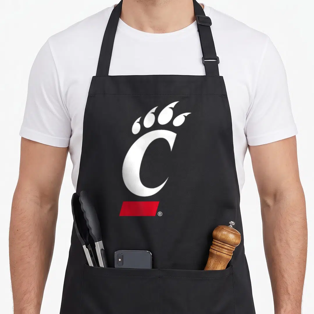Bearcat cincinnati apron - White C with four claws above and red rectangle below — shown on a black cotton canvas apron against a white background