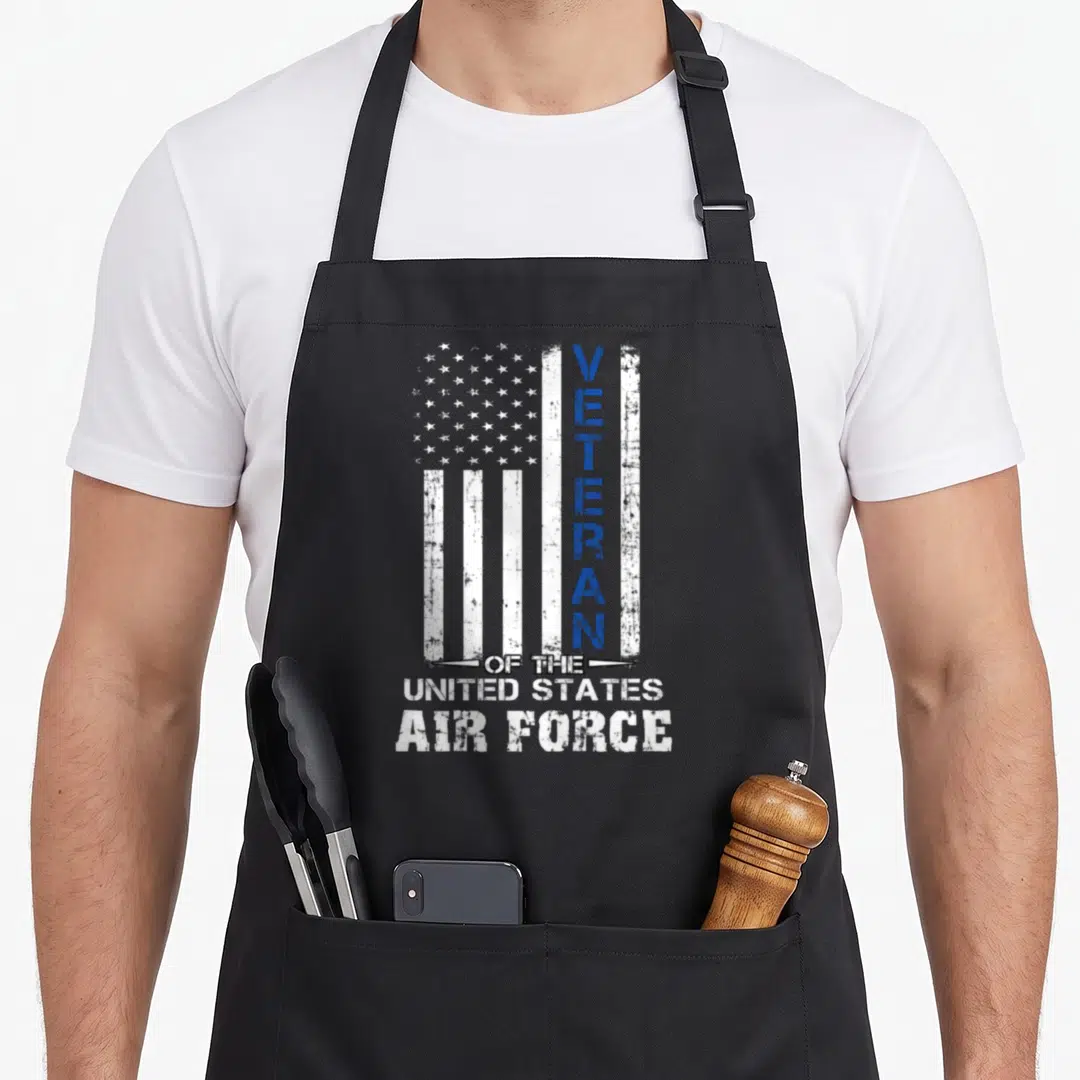 State air us aprons - Distressed US flag with vertical VETERAN text and stacked United States Air Force lettering — shown on a black cotton canvas apron against a white background