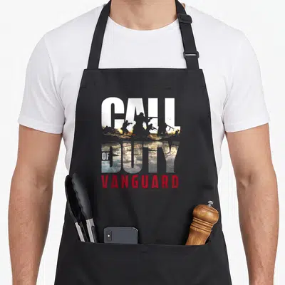 Vanguard video game apron - Call of Duty text filled with soldier silhouettes and red Vanguard lettering — shown on a black cotton canvas apron against a white background