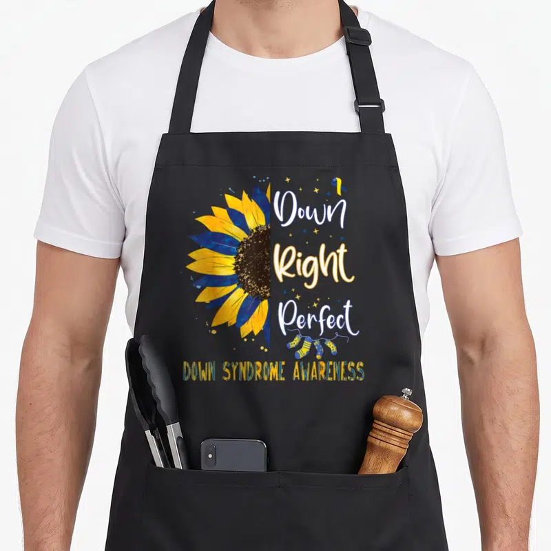 March down syndrome awareness apron - Half sunflower yellow blue white stacked text three socks awareness phrase — shown on a black cotton canvas apron against a white background