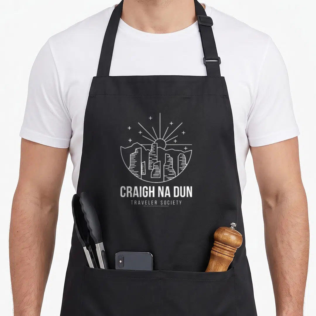 Craigh traveler apron - White line art of standing stones and sun with Craigh Na Dun text — shown on a black cotton canvas apron against a white background