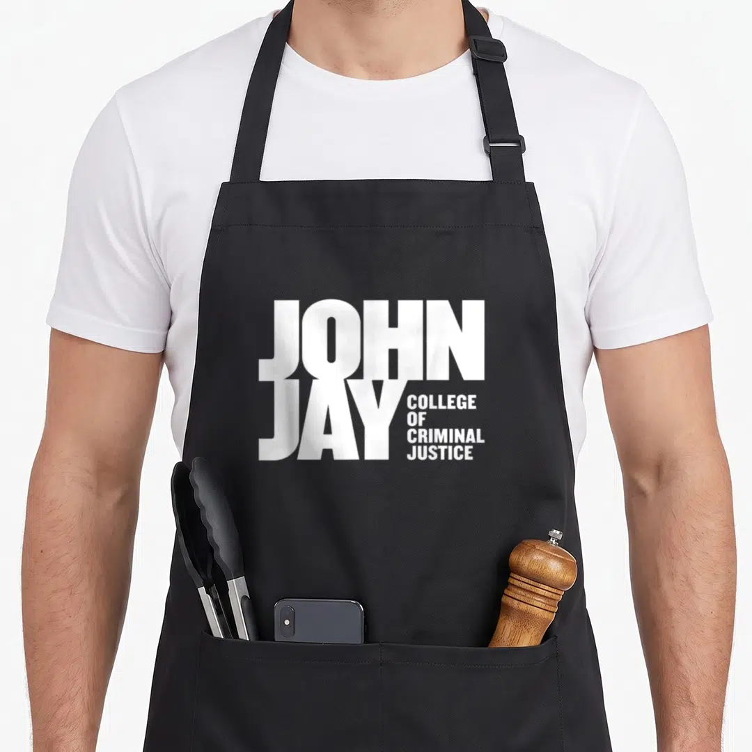 John jay lover apron - White stacked text reading JOHN JAY COLLEGE OF CRIMINAL JUSTICE in two columns — shown on a black cotton canvas apron against a white background