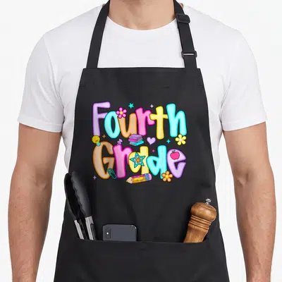Preppy teacher apron - Colorful Fourth Grade bubble letters with books, pencil, and apple icons — shown on a black cotton canvas apron against a white background