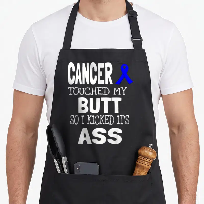Touched colon cancer awareness apron - White stacked text reading cancer touched my butt next to a blue awareness ribbon — shown on a black cotton canvas apron against a white background