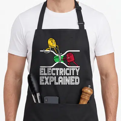 Ohm electricity apron - Three cartoon blobs labeled Ohm Amp and Volt pulling a white rope with Electricity Explained — shown on a black cotton canvas apron against a white background