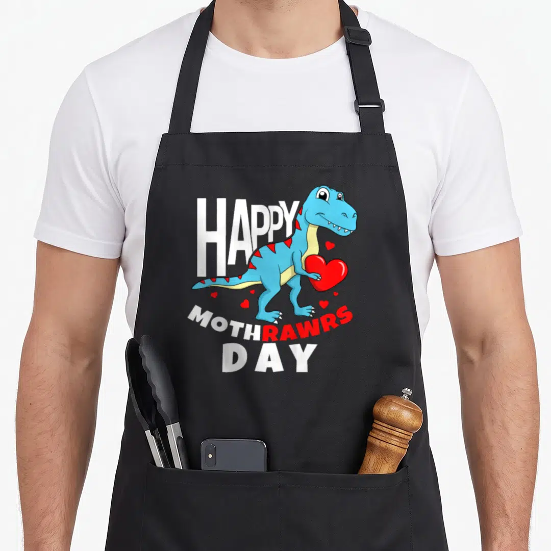 Trex mother's day aprons - Blue cartoon dinosaur holding red heart with HAPPY MOTHRAWRSDAY text — shown on a black cotton canvas apron against a white background