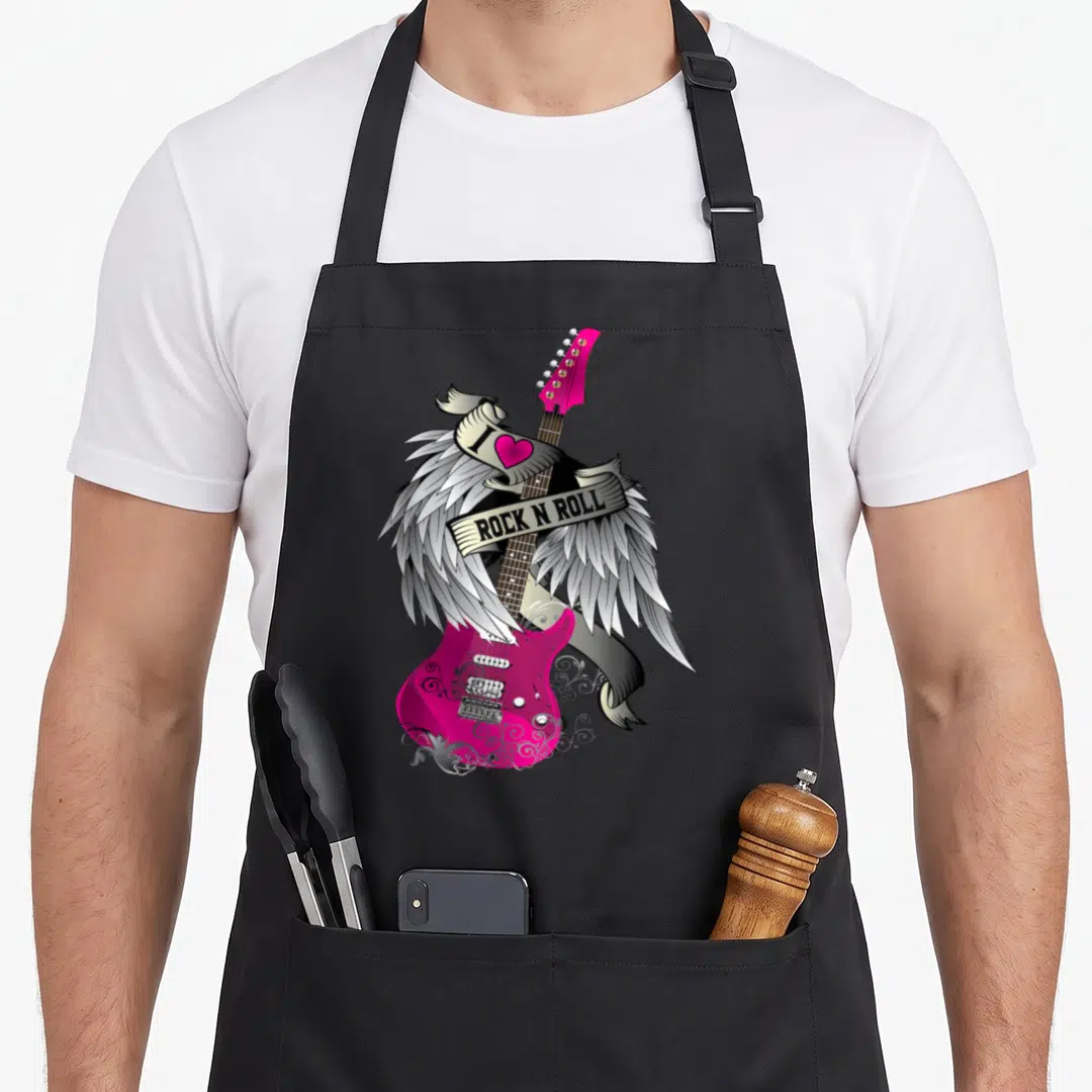 Rock angels in aprons - Pink electric guitar with silver wings and ribbon reading I Love Rock N Roll — shown on a black cotton canvas apron against a white background