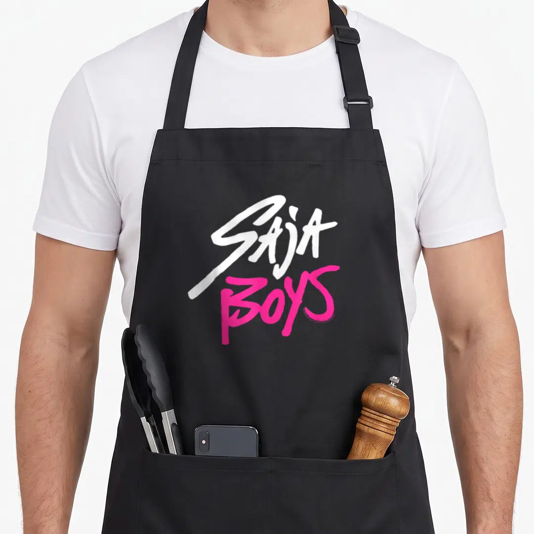 Band hunter apron - White SAJA and pink BOYS stacked typography logo design — shown on a black cotton canvas apron against a white background