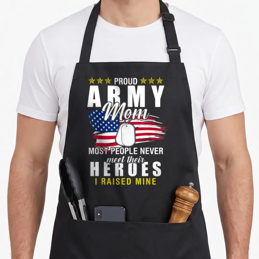 Army people meet apron - Distressed US flag and dog tag with text about raising an army hero — shown on a black cotton canvas apron against a white background